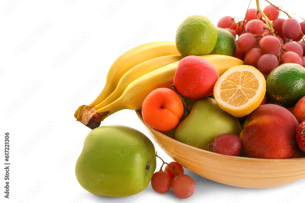 Bowl with different fresh fruits on white background