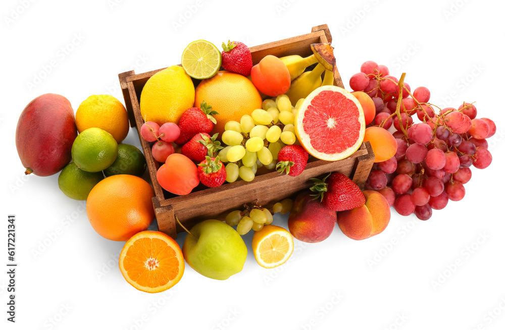 Wooden box with different fresh fruits on white background