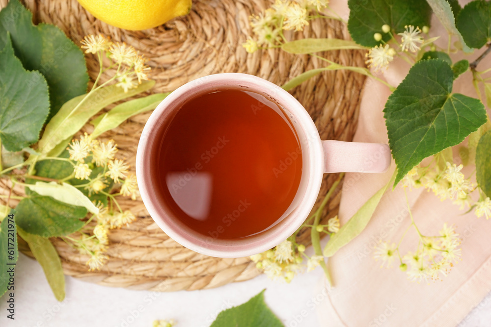 Cup of linden tea and lemon, closeup