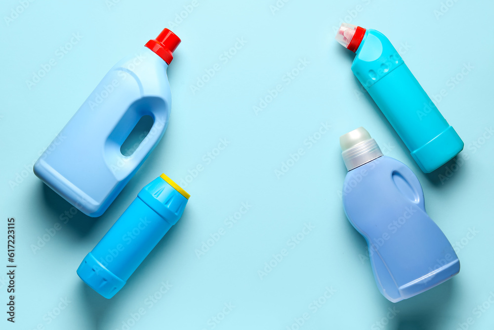 Bottles of detergent on blue background