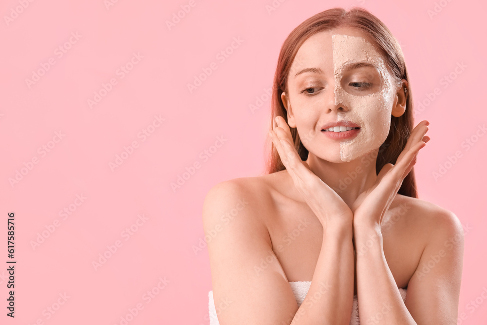 Young woman with applied turmeric mask on pink background