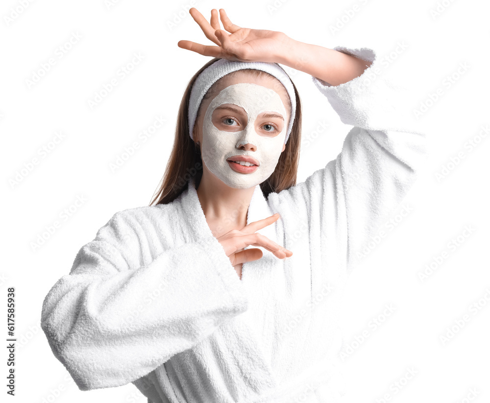 Young woman in bathrobe with applied turmeric mask on white background