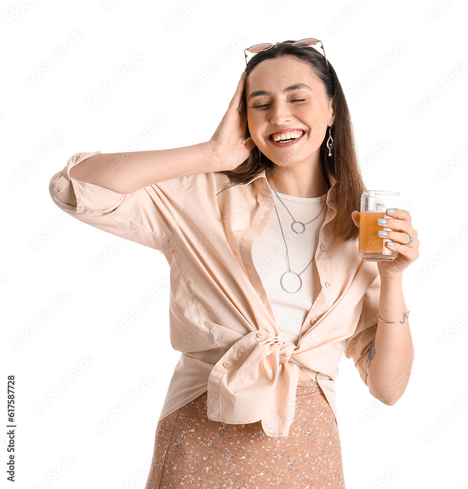 Young woman with glass of vegetable juice on white background