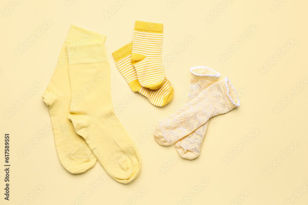 Set of cotton socks on color background