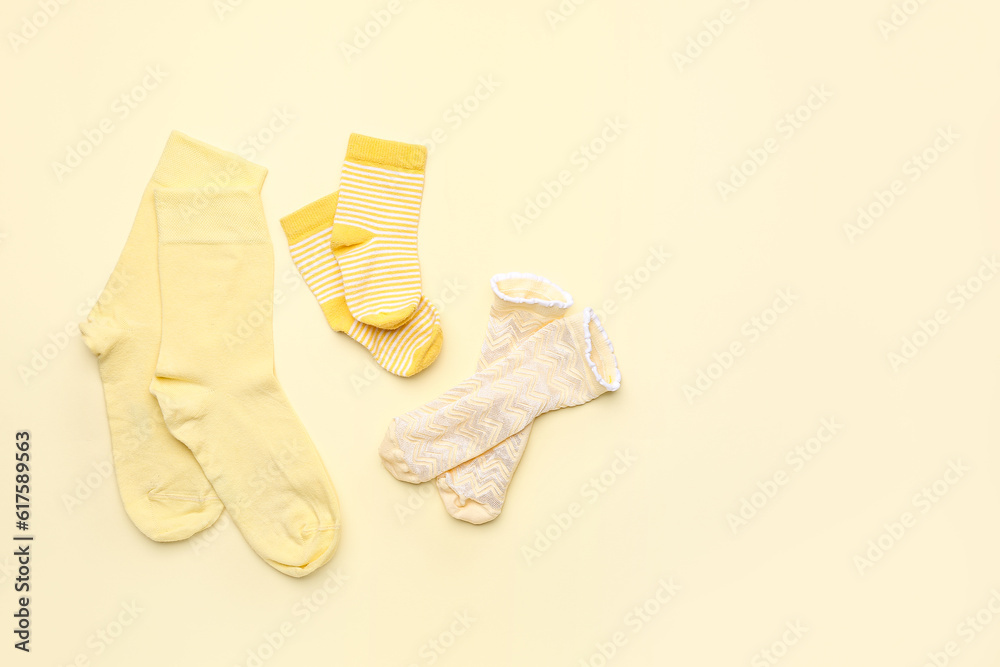 Set of cotton socks on color background