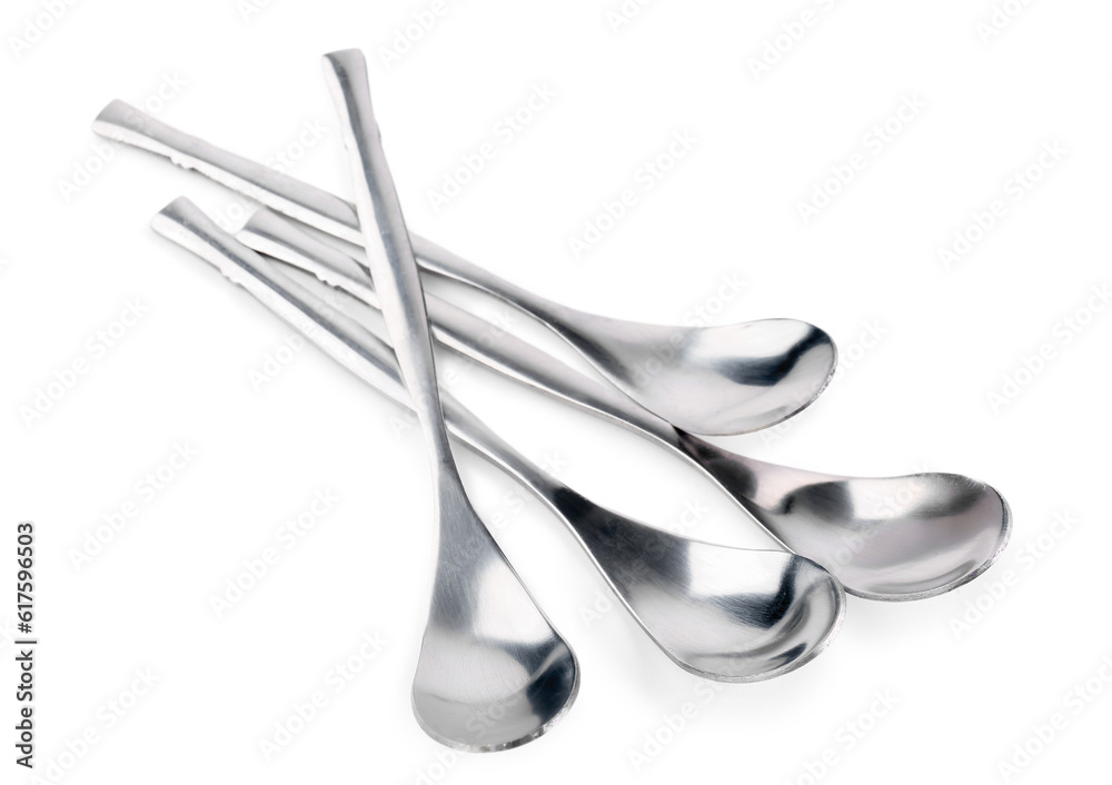 Stainless steel spoons on white background