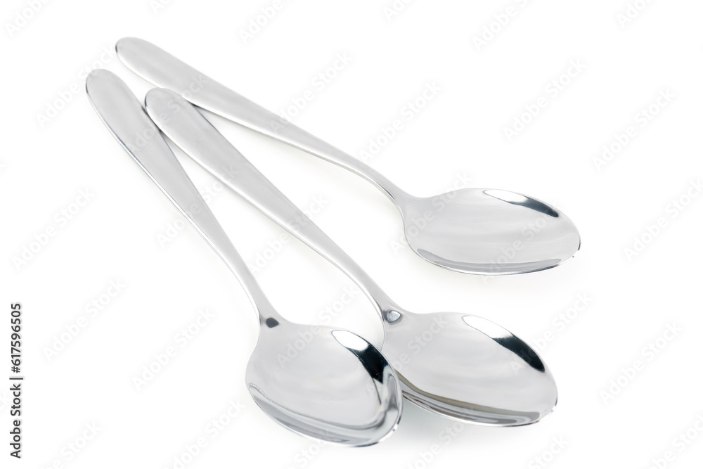 Stainless steel spoons on white background