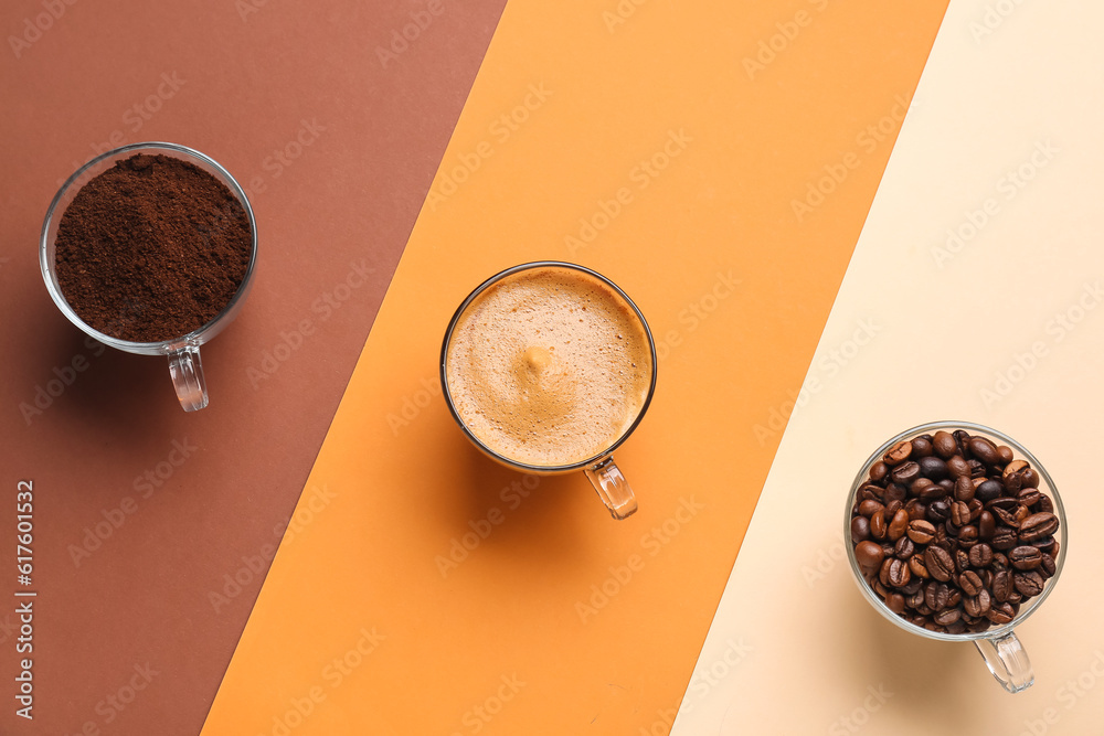 Cups of hot espresso and coffee beans on colorful background