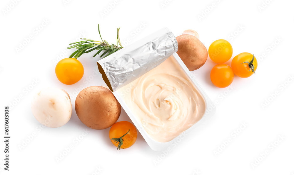 Plastic container with tasty cream cheese, tomatoes and mushrooms on white background