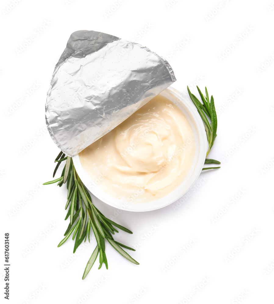 Plastic container with tasty cream cheese on white background