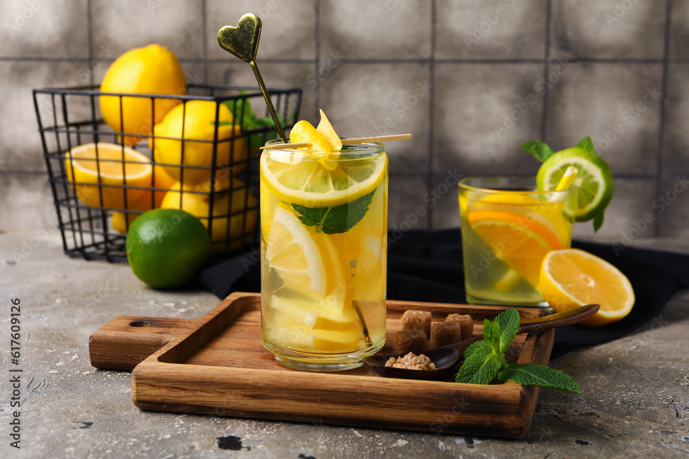 Glass of infused water with lemon on table