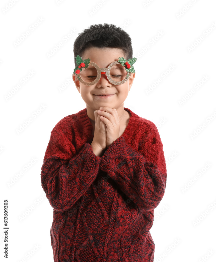 Cute little boy in paper eyeglasses and knitted sweater on white background