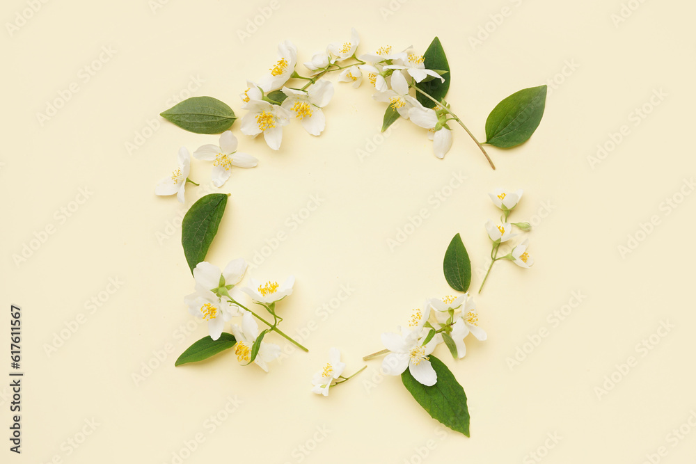 Frame made of fresh jasmine flowers on color background