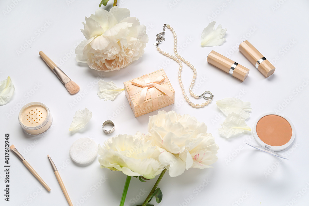 Composition with gift box, female accessories, cosmetics and peony flowers on white background