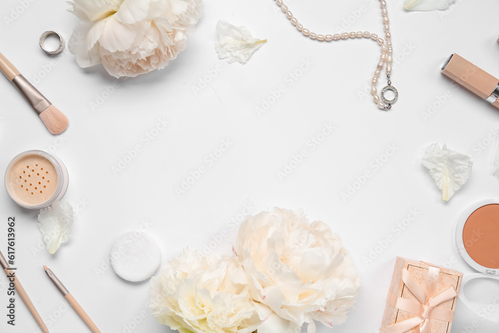 Frame made of female accessories, cosmetics and beautiful peony flowers on white background