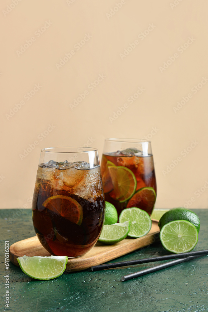 Glasses of cold Cuba Libre cocktail on table