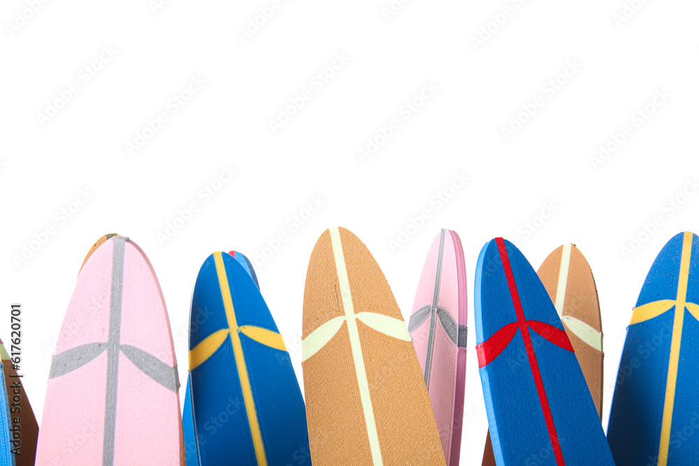 Many different mini surfboards isolated on white background