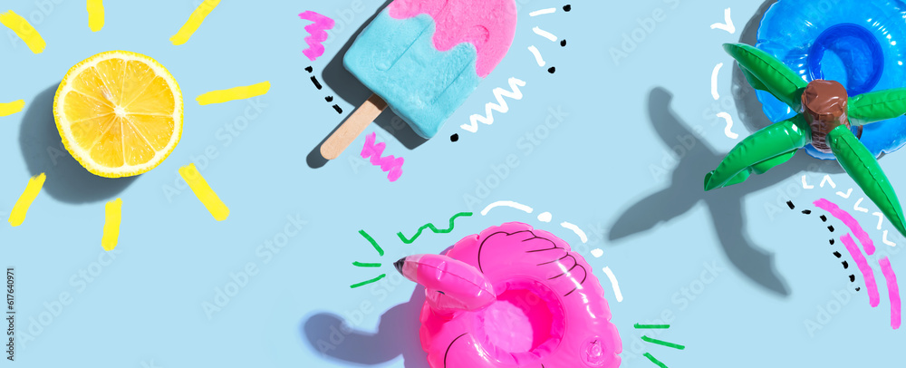 Summer concept with a flamingo float, lemon sunlight and a popsicle - flat lay