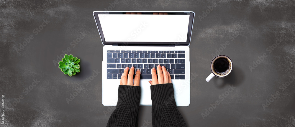 Person using a laptop computer from above