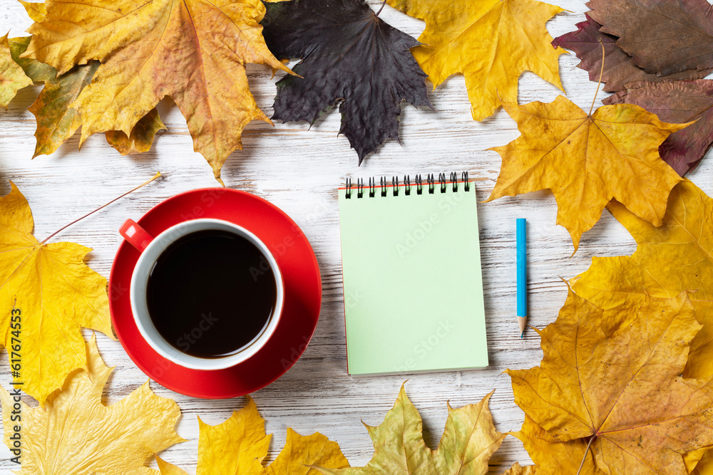 Flat lay autumn composition with cup of black tea