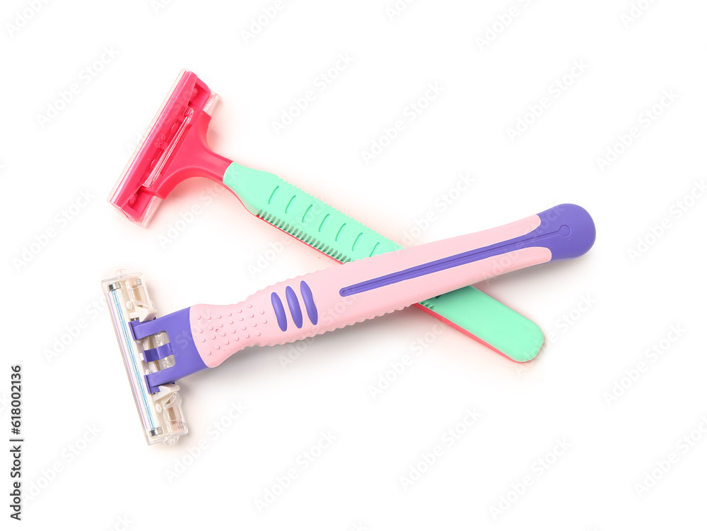 Two safety razors on white background