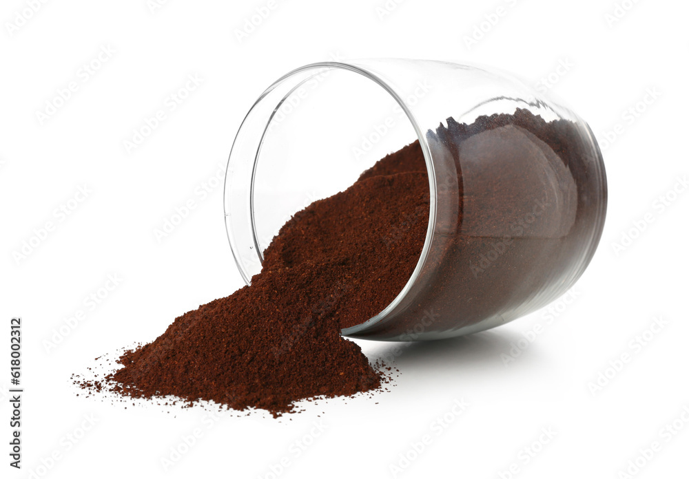 Overturned jar with coffee powder isolated on white background