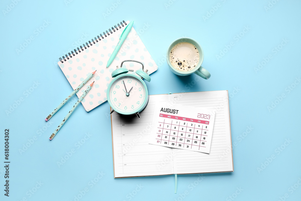 Composition with calendar, alarm clock, cup of coffee and notebook on blue background