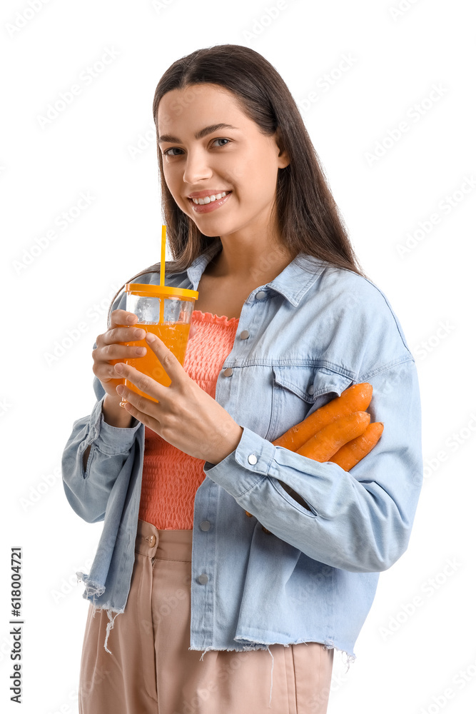 Young woman with glass of vegetable juice and carrots on white background