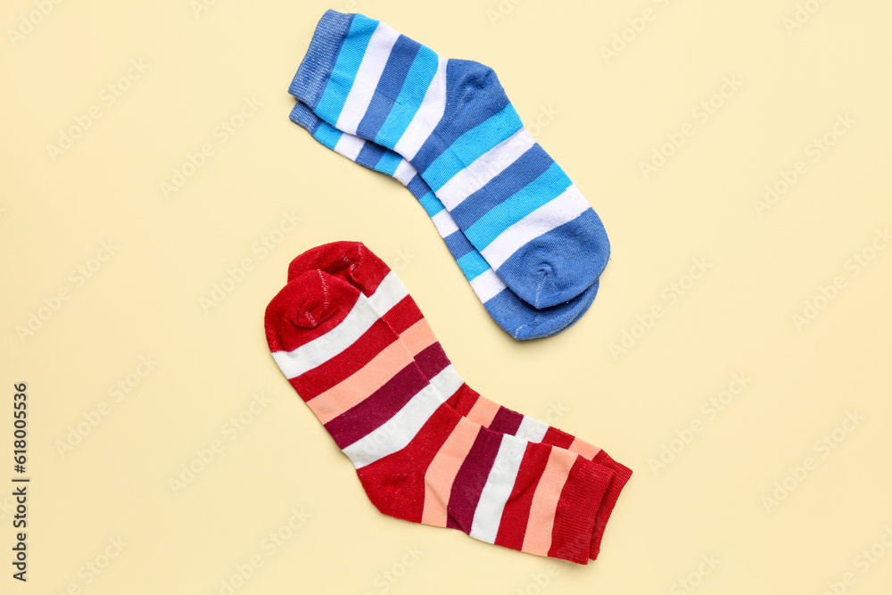 Striped cotton socks on color background