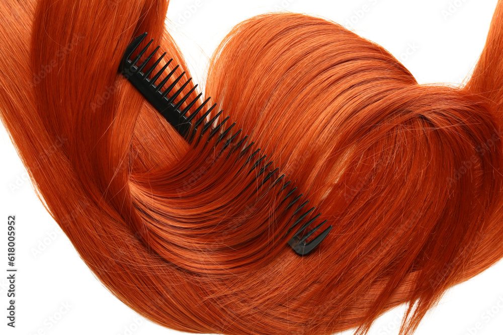 Ginger hair with comb on white background, closeup