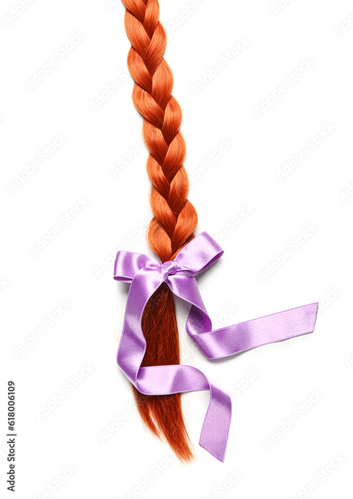 Braided ginger hair with bow on white background, closeup