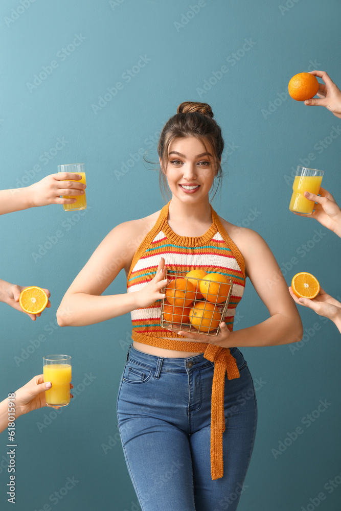 Young woman and hands with glasses of orange juice on blue background