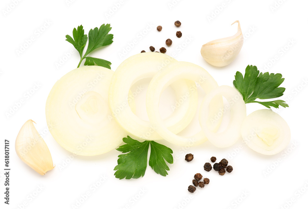 Fresh onion slices and spices on white background