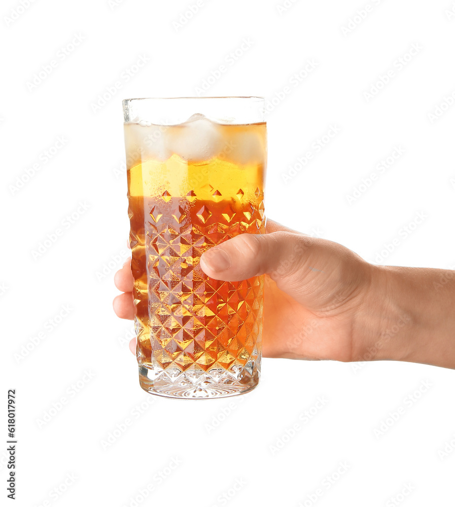 Female hand holding glass of ice tea on white background