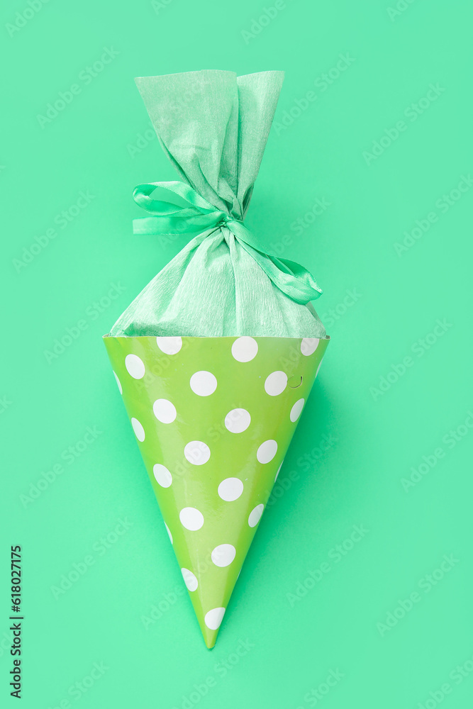 Beautiful school cone on green background