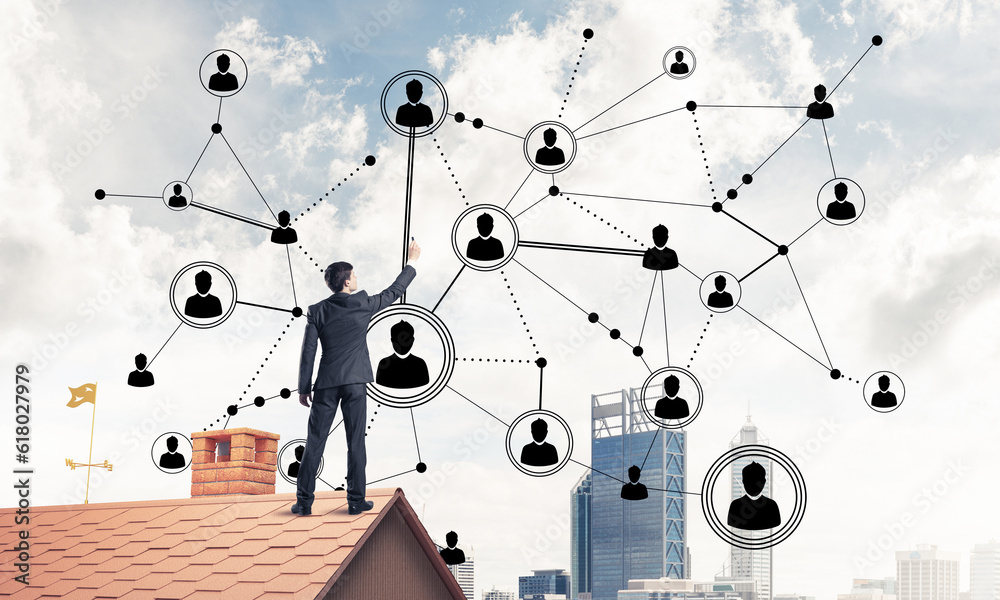 Businessman on house roof presenting networking and connection c