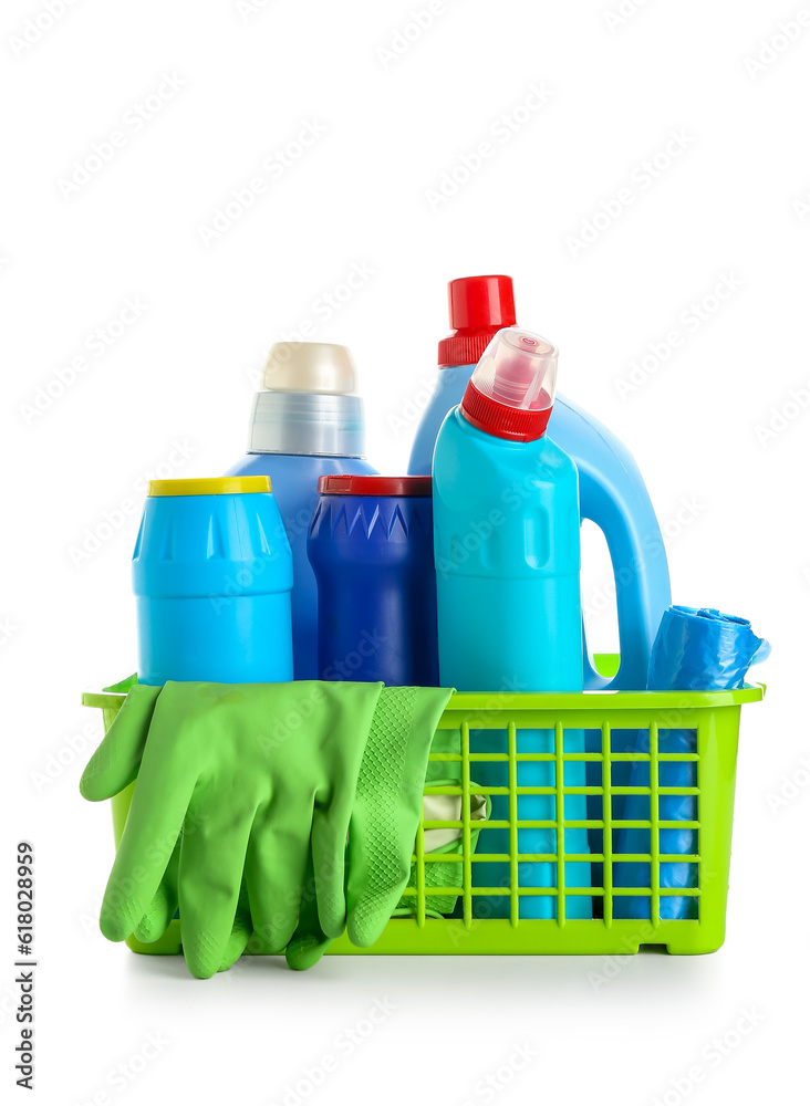 Basket with different cleaning supplies isolated on white background