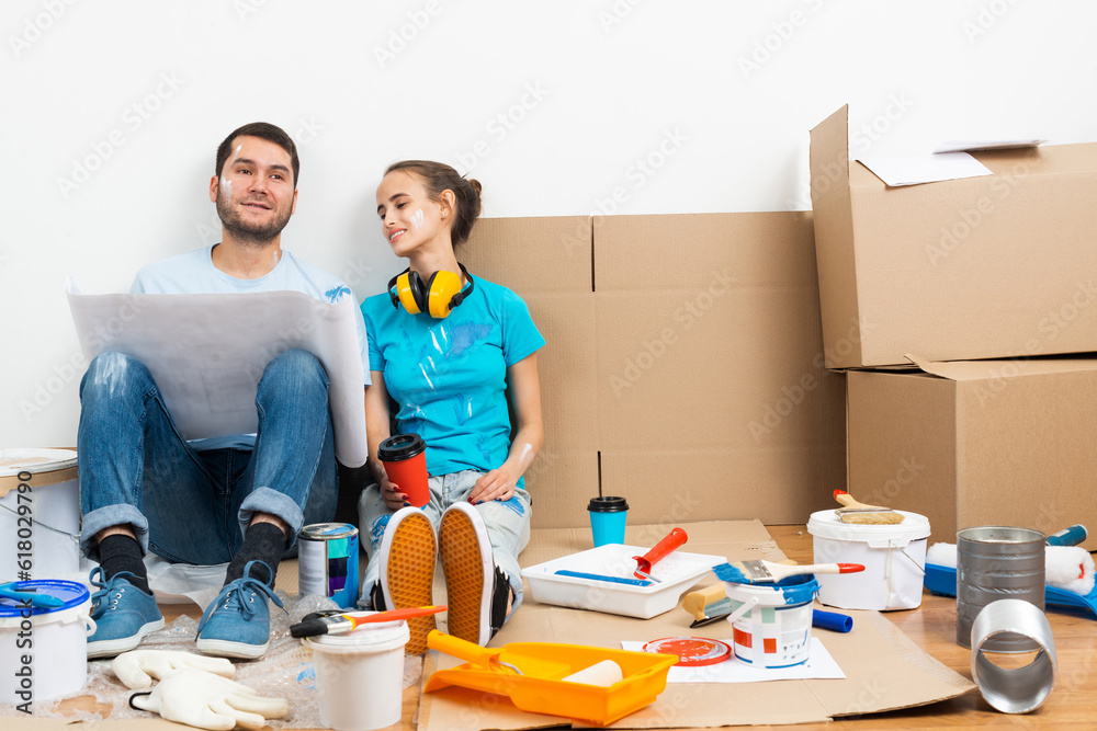 Young man and woman planning home renovation