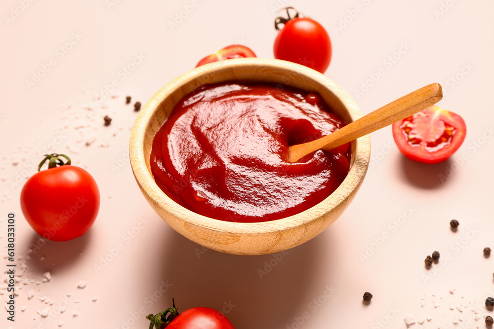 Bowl with tomato paste and fresh vegetables on light background