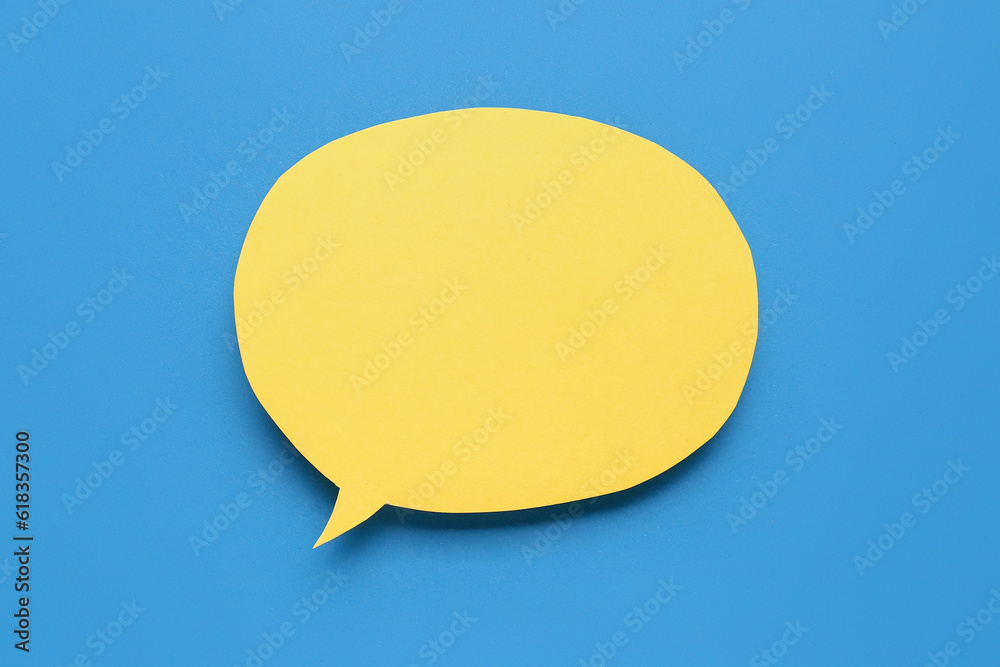 Blank paper speech bubble on blue background