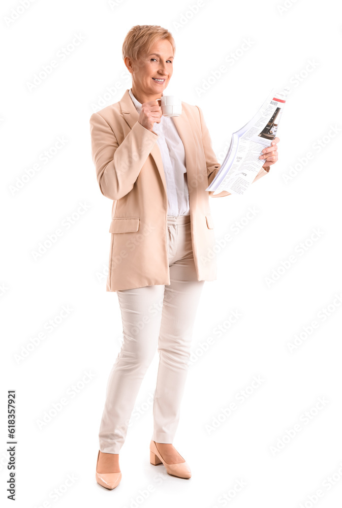 Mature businesswoman with coffee and newspaper on white background