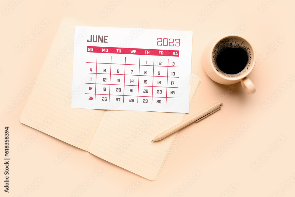 Calendar, notebook, pen and cup of coffee on beige background