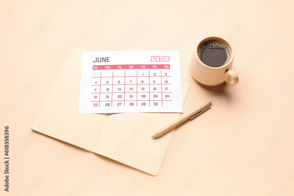 Calendar, notebook, pen and cup of coffee on beige background