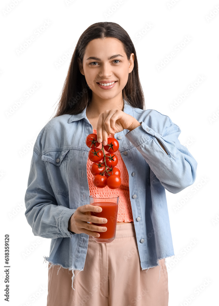 Young woman with glass of vegetable juice and tomatoes on white background