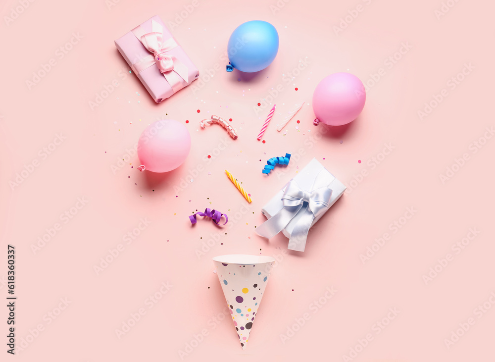 Composition with different party decor on pale pink background