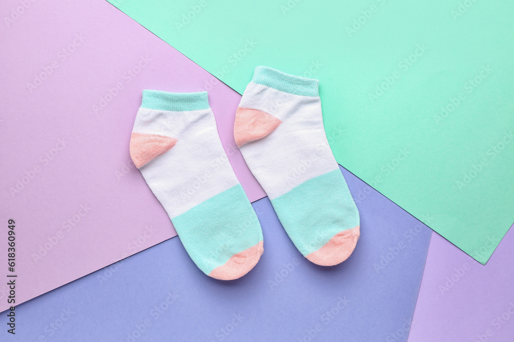 Cotton socks on color background