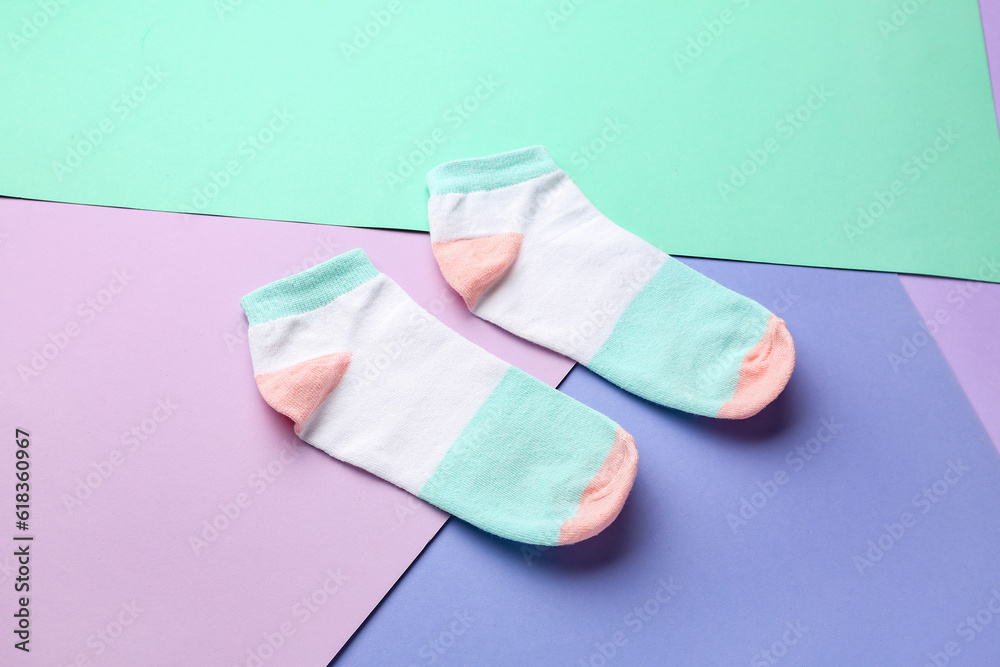 Cotton socks on color background