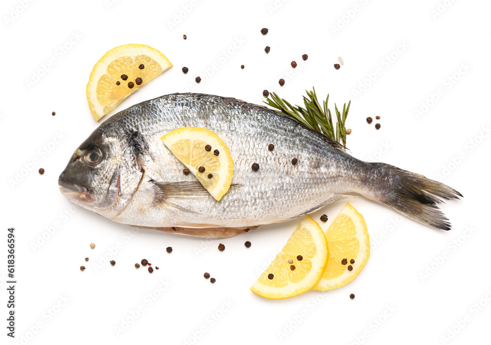 Raw dorado fish with lemon on white background