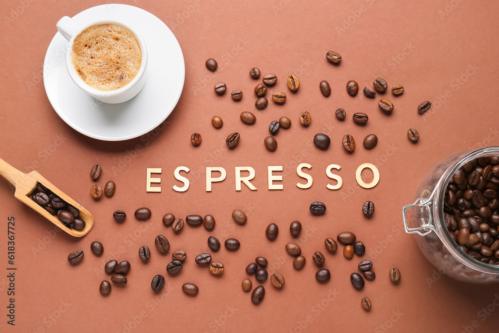 Word ESPRESSO and cup of hot coffee with beans on brown background