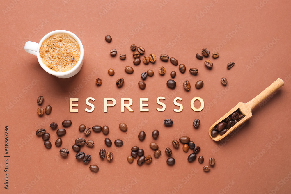 Word ESPRESSO and cup of hot coffee with beans on brown background